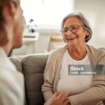 Female doctor consulting her senior patient
